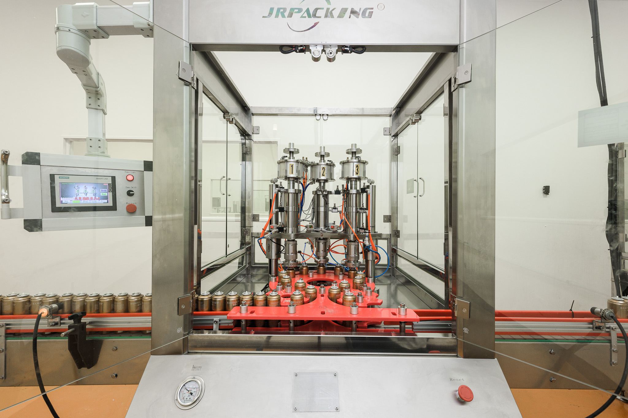 Close view of the rotary aerosol filling machine