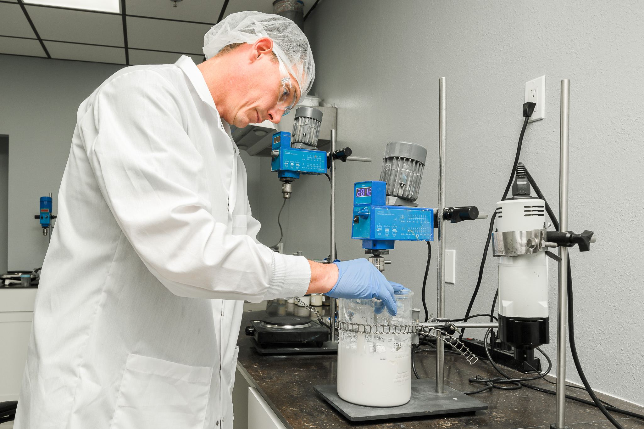 Chemist mixing a formulation with an overhead stirrer in the lab