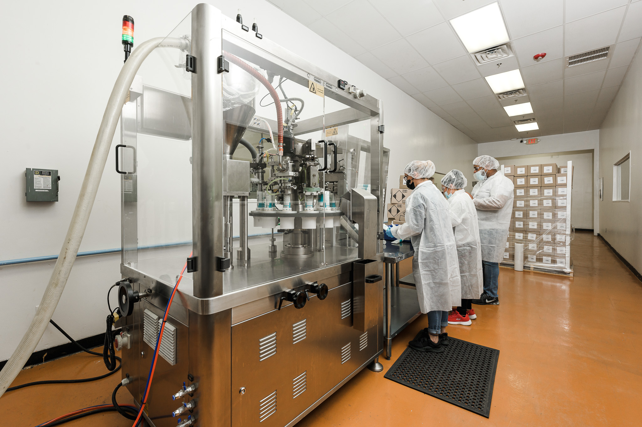 Operators running an automated filling line